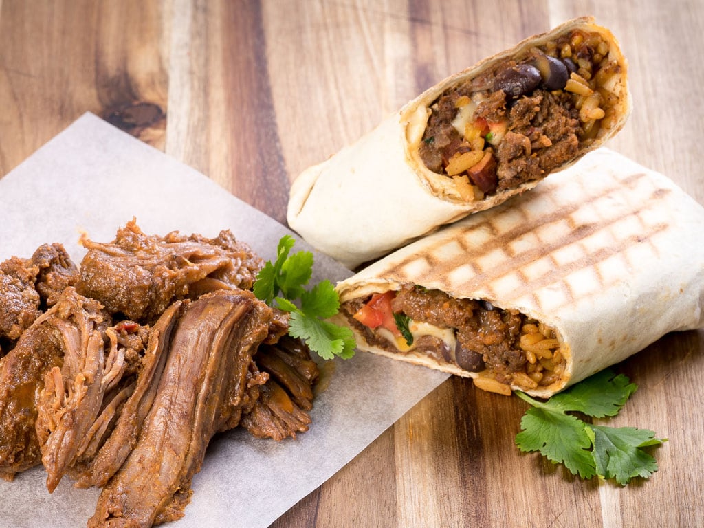 Dawn Farms Beef Barbacoa served in a burrito wrap with rice and beans.
