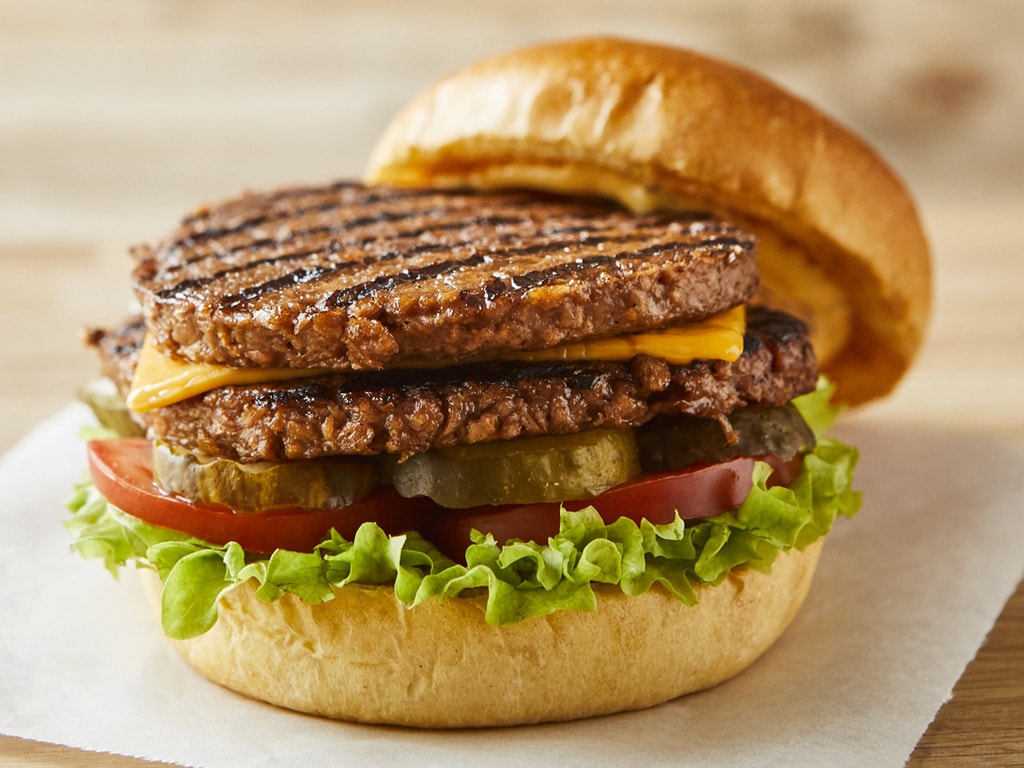 A mouthwatering, double stacked meat-free burger, with two Plant Deli Burger patties, cheese and salad.
